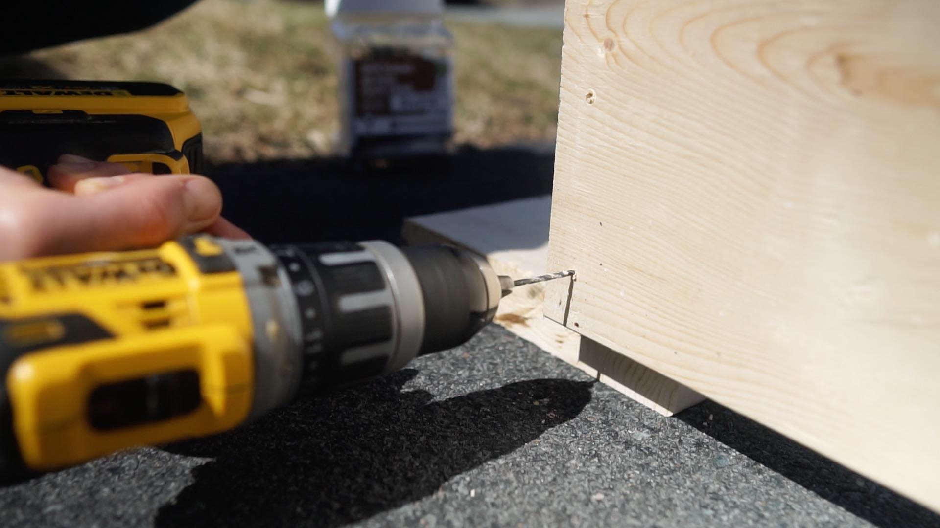 dewalt drill drilling a hole in wood